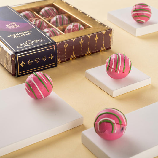 9-piece cranberry heart-shaped truffles in a box