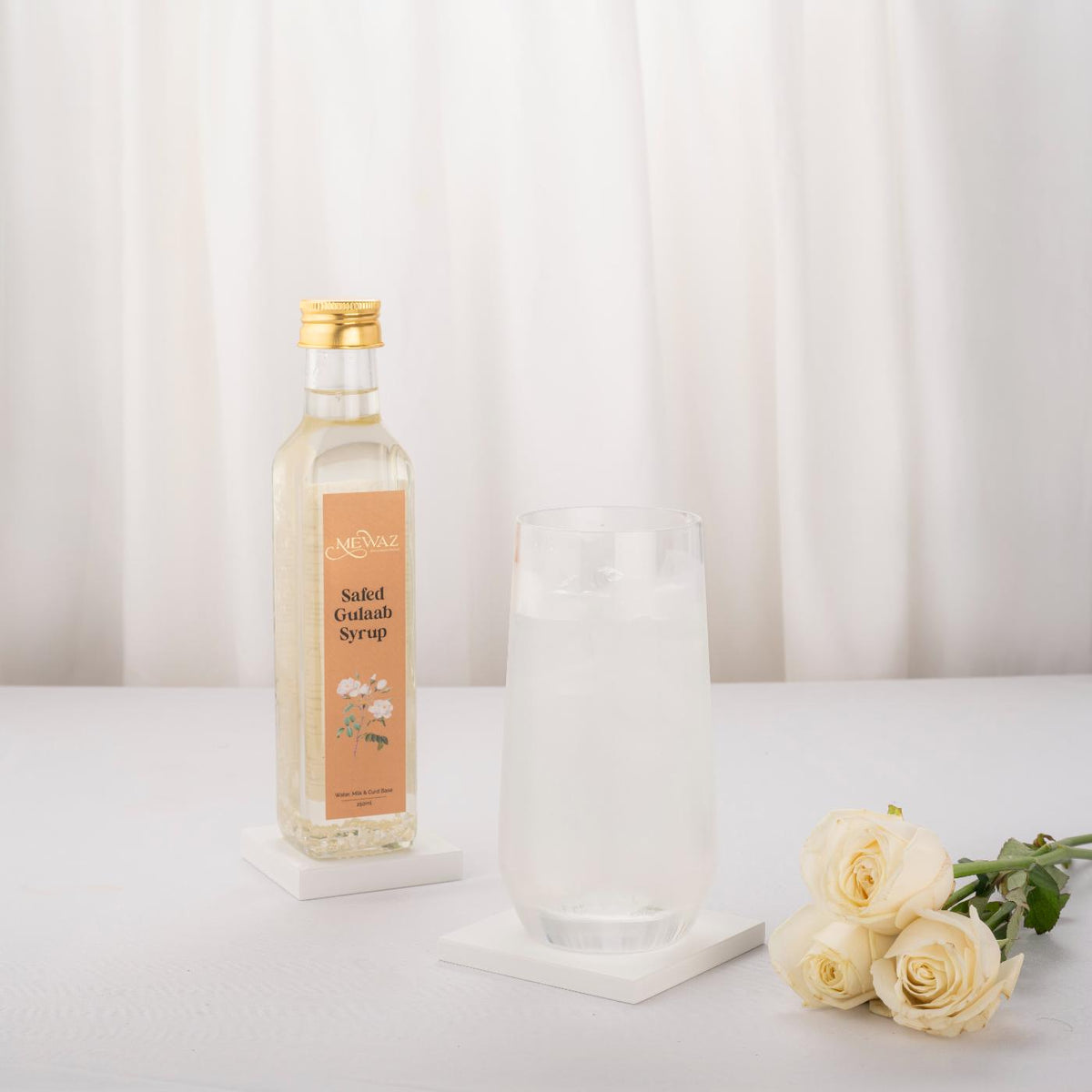 White rose sharbat in a bottle, ideal for sweet beverages