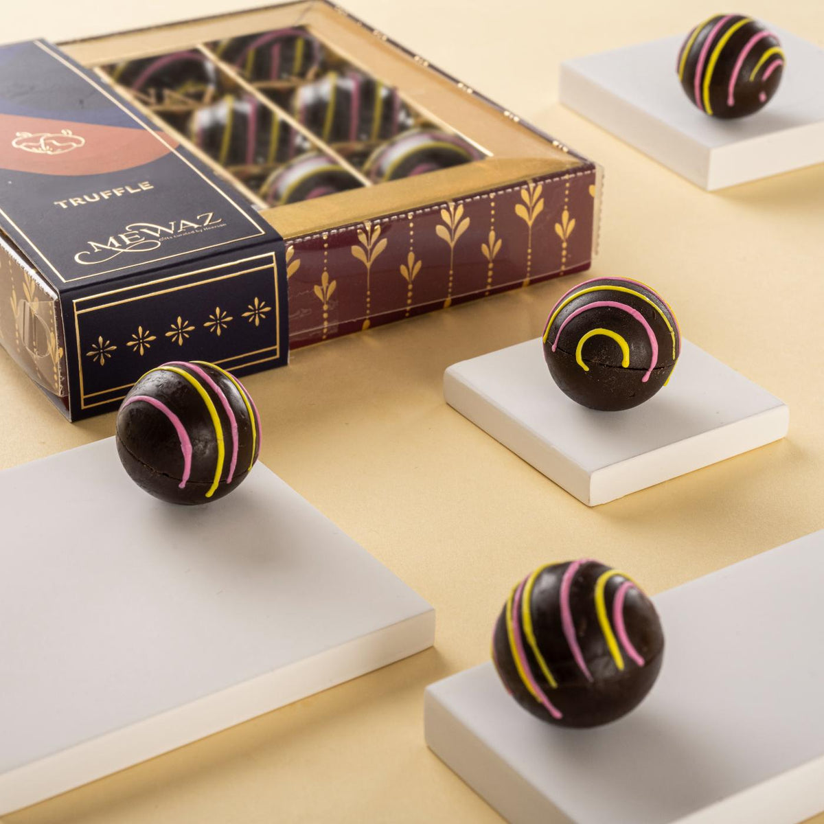 Tangerine-flavored truffle chocolates in a 9-piece box